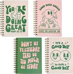 three spiral notebooks with different designs on the front and one has an image of a baby