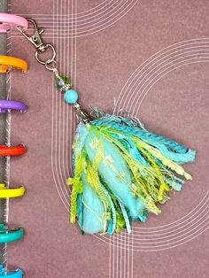 a keychain that has been made to look like feathers