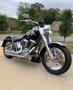 a black and chrome motorcycle parked on the street