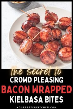 bacon wrapped kielbasa bites on a white plate with text overlay that reads the secret to crowd pleasing bacon wrapped kielbasa bites