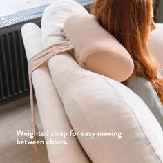 a woman sitting on top of a couch with a pillow over her shoulder and the words weight strap for easy moving between chairs