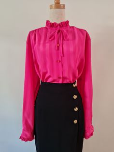 Right On by Remona Melbourne, Fuschia pink self stripe long sleeved jacquard blouse with ruffles at neckline and cuff. Button through with button cuff and simple rouleau mock bow at neckline.  She's marked a fabulous plus size 20, but see measurements below to check on actual sizing (closer to an 18). Fuschia Pink  100% Polyester Very Good Condition Body Length from HPS -  71cm  Sleeve length from CB Neck - 79cm   Shoulder width - 45cm  Bust - 62cm  Hip - 62cm Follow us on Instagram @packratt_vi Fuschia Top, Steampunk Fashion Women, Ruffle Neck Blouse, Jacquard Blouse, Plus Size Blouse, Fuschia Pink, Crepe Dress, Pink Outfit, Plus Size Blouses