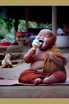 a baby sitting on the ground eating an ice cream cone with his mouth wide open