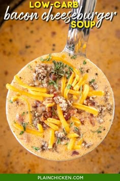 a spoon full of soup with cheese and meat