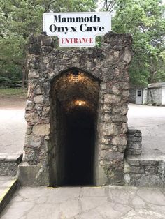 the entrance to mammoth onyx cave is shown in front of a sign that says entrance