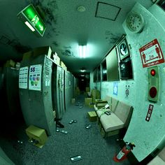 the inside of an office building with lots of boxes on the floor and furniture scattered around