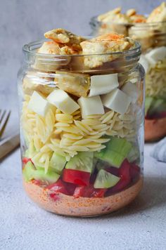 two mason jars filled with pasta salad