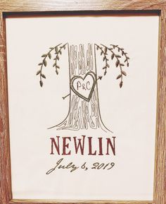 a wedding guest book with a tree and heart in the middle, on a white background