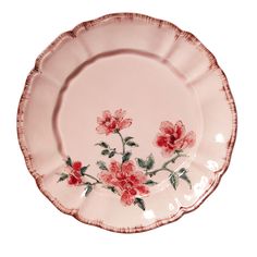 a pink plate with flowers painted on it