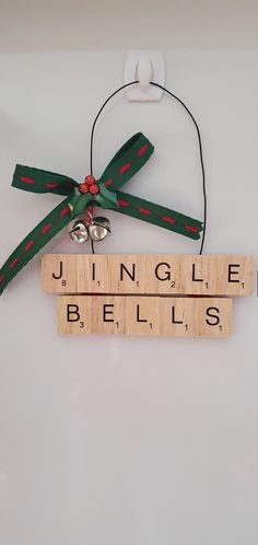 JINGLE BELLS! JINGLE BELLS! Oh what fun... everyone will have with this charmimg handmade ornament. A unique gift for the scrabble aficionado in your life- it's also perfect for secret santas, stocking stuffers, hostess gifts- anyone! Every ornament is handmade to order using individual scrabble tiles that are backed in soft red velvet and hung with sturdy black wire. Decorated with REAL jingle bells, vintage inspired ribbon and topped off with festive miseltoe, you'll be sure to enjoy this uniq Christmas Crafts Scrabble Letters, Crafts With Scrabble Tiles, Scrabble Tile Crafts Christmas Gifts, Scrabble Ornaments Diy, Christmas Scrabble Tiles, Scrabble Christmas Ornaments, Scrabble Christmas, Scrabble Letter Crafts, Scrabble Gifts