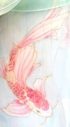 a painting of a pink fish on a blue shirt with white and yellow stripes in the background