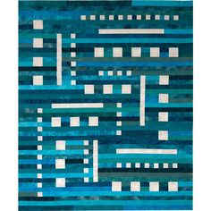 a blue rug with white squares and lines on the bottom, in shades of teal