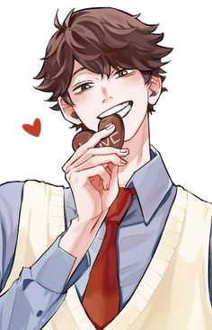 a man eating a chocolate donut while wearing a red neck tie and sweater shirt