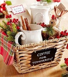 a wicker basket filled with coffee mugs and other holiday items sitting on a table