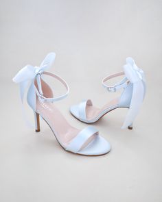 Classic satin high heel sandals adorned with satin back bow and pearl band for romantic, elegant and feminine look. Simple and easy wear for bridal wear, bridesmaids, holiday party, wedding parties, and any special occasions.  DETAILS: HEEL HEIGHT: 3.5 Inches COLORS AVAILABLE: Ivory, White and Light Blue UPPER: Synthetic upper and lining MATERIALS: Manmade outsole STYLE NAME: DEMI Not sure of which size to purchase? Shoes measurements are as follow: (Please note measurements taken the length of Sky Blue High Heels, Light Blue Prom Heels, Pastel Blue Heels, White And Blue Heels, Pale Blue Heels, Wedding Shoes Simple, Light Blue High Heels, Heels Light Blue, Satin And Pearls