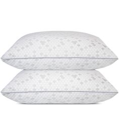 two white pillows sitting next to each other