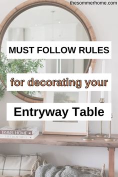 a table with a mirror and pillows on it, the text must follow rules for decorating your entryway table