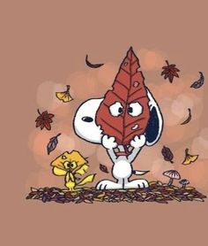 a cartoon character holding a leaf in front of fall leaves