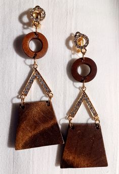 Very natural and classy style  All wood and nice size  Very lightweight  These hang about 3.5 inches  brown wood and Gold and Rhinestone accents and clip on closure  One of kind piece These are a great addition to any unique wardrobe Wood And Gold, Unique Wardrobe, Bamboo Earrings, Classy Style, Gold Wood, Etsy Earrings Dangle, Brown Wood, Chicago Il, Fashion Classy