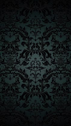 an ornate black and blue wallpaper pattern