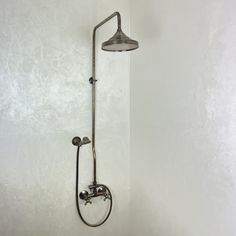 a shower head and hand shower in a bathroom