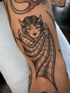 a woman's arm with a tattoo on it