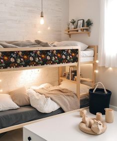 a bedroom with bunk beds and lights on the wall