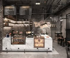 the interior of a cafe with brick walls and tables