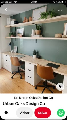 a desk with two chairs and shelves above it, in the middle of a room