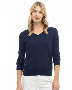 Our Essential V Neck sweater, made from 100% pure, sustainably sourced cashmere, blends ethical fashion with timeless style. Its V-neckline is artfully crafted, offering a tasteful depth that elegantly frames the collarbone area while maintaining a balanced aesthetic. This sophisticated sweater is designed to define your waist, with a slightly elongated length suitable for various styles and occasions. Its fine cashmere gauge offers versatility, ideal for a polished look with trousers and a belt Balanced Aesthetic, Essential Wardrobe Pieces, Chic Casual, Women Essentials, Ethical Fashion, Polished Look, V Neck Sweater, Timeless Style, Vneck Sweater