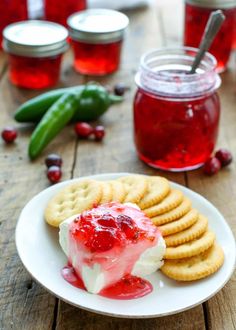 a white plate topped with crackers covered in jelly