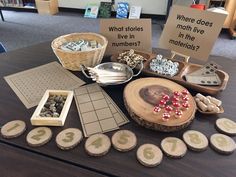 a table topped with lots of different types of wooden slices and magnets on top of it