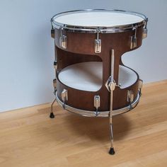 a close up of a drum on a wooden floor