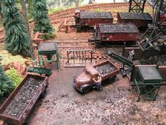 a model train set with cars and trucks