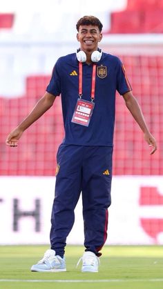 a man standing on top of a soccer field