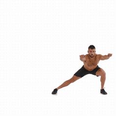 a man in black shorts and no shirt is doing a kickbox pose with his arms out