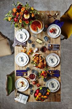 an overhead view of a table with plates and food on it, surrounded by hearts