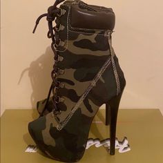 New. Never Worn Casual Camouflage Boots With Round Toe, Ankle-high Lace-up Boots With Stacked Heel, Black High Heel Lace-up Boots In Faux Leather, Red Timberland Boots, Black High Heel Lace-up Boots With Buckle Closure, Camo Heel Boots, Green Lace-up Boots With Reinforced Heel, Camo Heels, Marc Fisher Boots