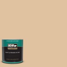 the behr ultra paint is shown in an open, beige color with a light brown base