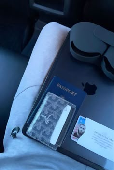 an apple passport sitting in the back seat of a car