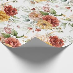 a white table topped with flowers on top of it's surface and a corner cut out in the middle