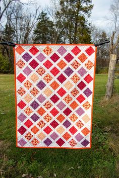 36"x49" READY TO SHIP! Handmade Baby Quilt - a vibrant quilt designed to wrap your little one in warmth and love. Measuring 36 inches by 49 inches, this quilt is perfectly sized to provide comfort and coziness for your precious bundle of joy. This lattice pattern features vibrant corals, purples, oranges, deep pink and crisp white fabrics. Made with love and attention to detail, this Handmade Baby Quilt is not just a practical accessory but a heartfelt expression of care. Whether draped over a crib, used for tummy time, or simply cherished as a decorative keepsake, this quilt adds a personalized and whimsical touch to your baby's space. Orange Quilts Ideas, Orange Quilts, Orange Quilt, Handmade Baby Quilts, Lattice Pattern, Quilts Ideas, Deep Pink, Bundle Of Joy, Tummy Time