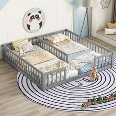 two baby cribs sitting on top of a rug in a child's room