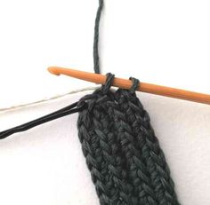 a close up of a crochet hook with yarn