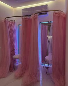 a room that has pink curtains in it