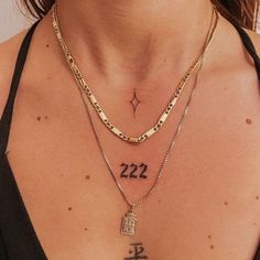 a close up of a person wearing a necklace with the number 22 on it's chest