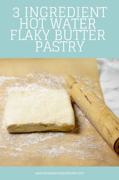 an uncooked pastry sitting on top of a counter next to a rolling pin