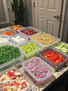 several plastic containers filled with different types of food