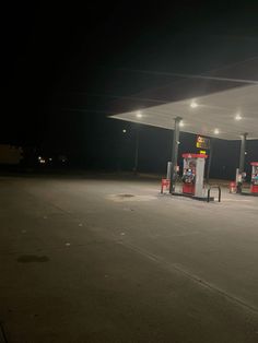 an empty gas station at night with no people