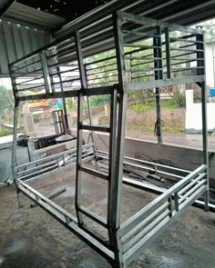 the inside of a building with metal railings and bars attached to it's sides